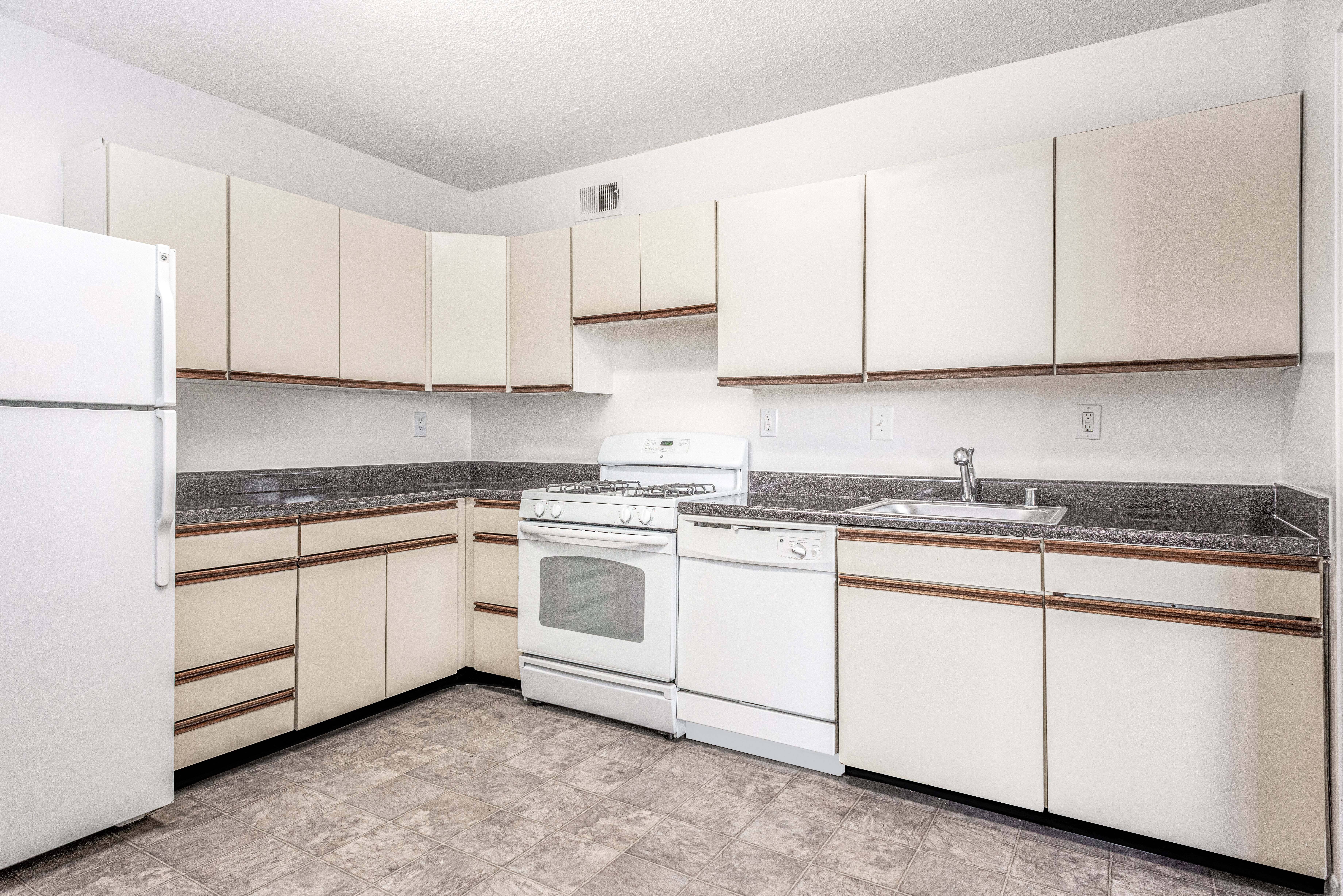 Update kitchen counters with ample storage space and gas range